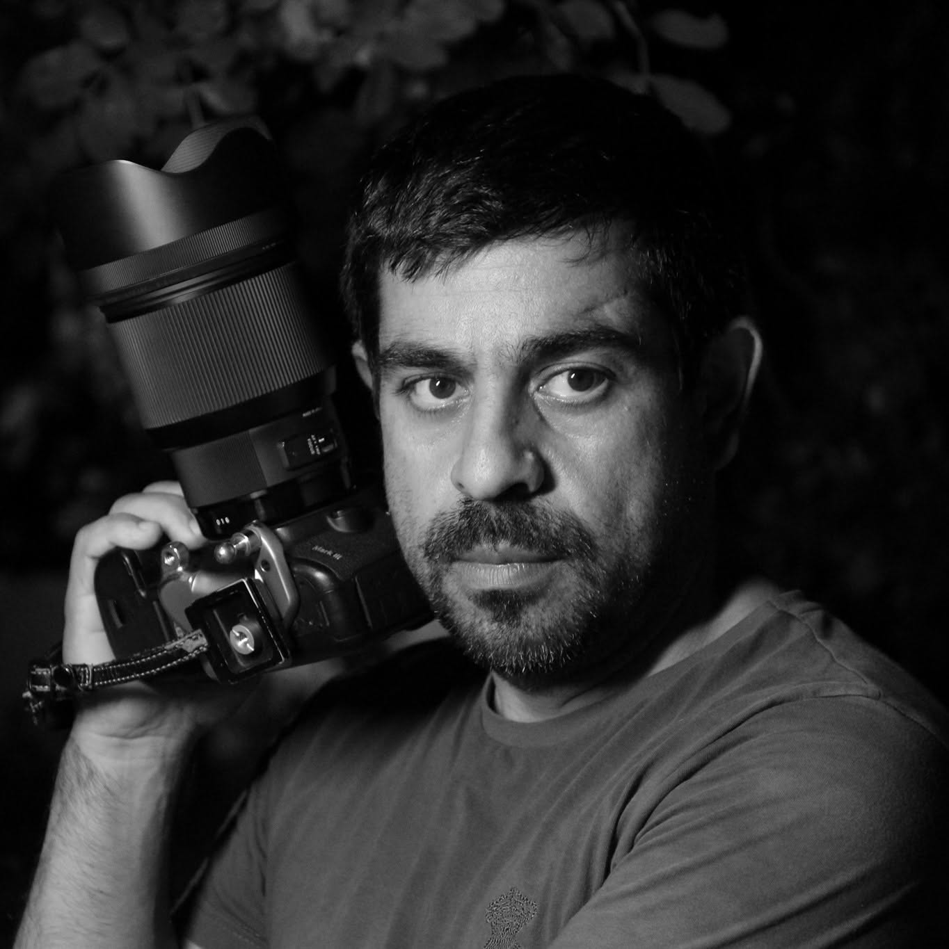 Timotheos Mouzourakis holding his camera